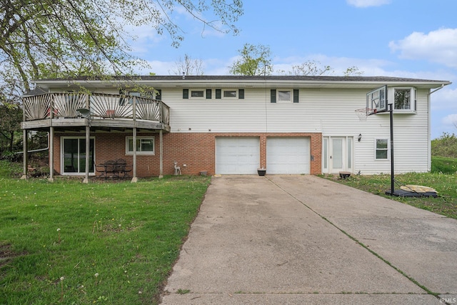 rear view of property with a deck, an attached garage, brick siding, and a lawn