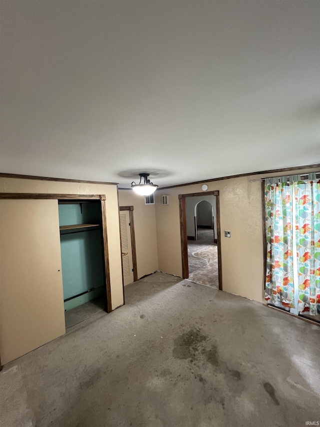 interior space featuring visible vents and unfinished concrete flooring