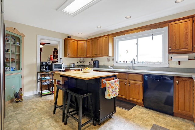 3806 S State Road 3, New Castle, IN 47362 - kitchen with a center island, brown cabinets, wood counters, a kitchen breakfast bar, and dishwasher