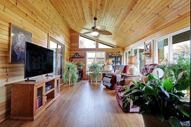 3806 S State Road 3, New Castle, IN 47362 - living area featuring wood ceiling, a ceiling fan, hardwood / wood-style floors, wooden walls, and vaulted ceiling