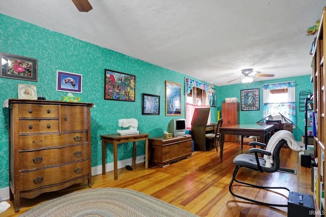 3806 S State Road 3, New Castle, IN 47362 - home office with a ceiling fan, a textured ceiling, and wood finished floors