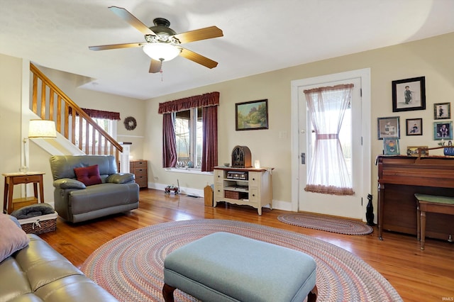 3806 S State Road 3, New Castle, IN 47362 - living room featuring baseboards, stairway, wood finished floors, and a ceiling fan