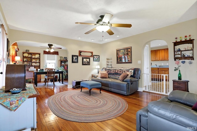 3806 S State Road 3, New Castle, IN 47362 - living area with hardwood / wood-style flooring, arched walkways, and a ceiling fan