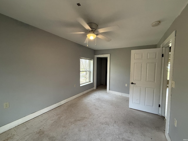 408 N 8th St, Petersburg, IN 47567 - unfurnished bedroom featuring baseboards, carpet floors, a closet, and a ceiling fan