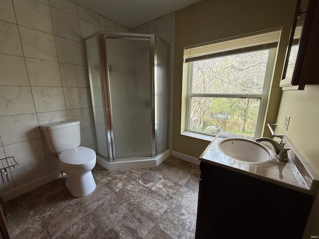 408 N 8th St, Petersburg, IN 47567 - full bathroom with tile walls, vanity, toilet, and a stall shower