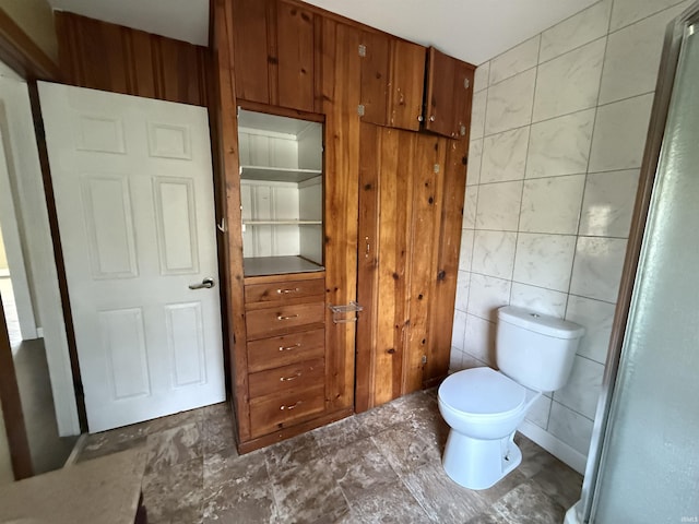 408 N 8th St, Petersburg, IN 47567 - bathroom featuring tile walls and toilet