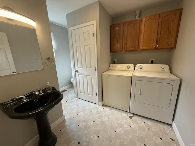 408 N 8th St, Petersburg, IN 47567 - washroom with washing machine and dryer, baseboards, light flooring, and cabinet space