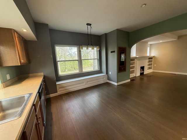 408 N 8th St, Petersburg, IN 47567 - kitchen featuring baseboards, dark wood-style floors, a sink, light countertops, and recessed lighting