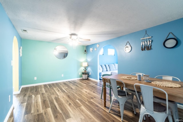 11910 E 690 S, Hudson, IN 46747 - dining room featuring ceiling fan, a textured ceiling, visible vents, and wood finished floors