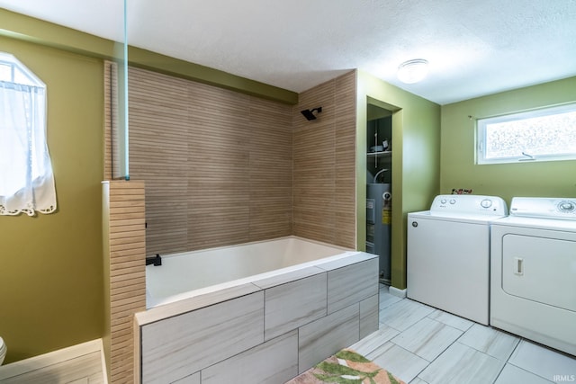 11910 E 690 S, Hudson, IN 46747 - laundry area with washing machine and clothes dryer, baseboards, laundry area, and electric water heater