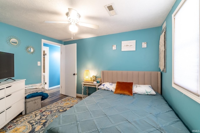 11910 E 690 S, Hudson, IN 46747 - bedroom featuring baseboards, ceiling fan, visible vents, and wood finished floors