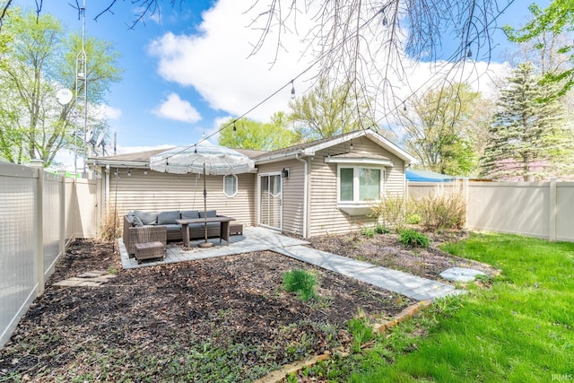 11910 E 690 S, Hudson, IN 46747 - rear view of property featuring a fenced backyard, a patio, and an outdoor living space