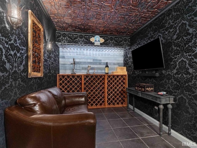 1817 Prestwick Ln, Fort Wayne, IN 46814 - wine cellar with baseboards, an ornate ceiling, wallpapered walls, and dark tile patterned floors