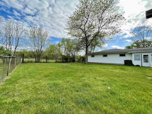 view of yard featuring fence