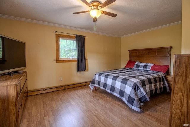 12190 W County Line Rd, Plymouth, IN 46563 - bedroom featuring ornamental molding, baseboards, a ceiling fan, and wood finished floors