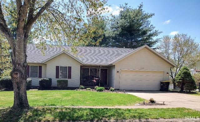 337 W White Pine Ct, Bloomington, IN 47403 - single story home with driveway, roof with shingles, an attached garage, and a front yard