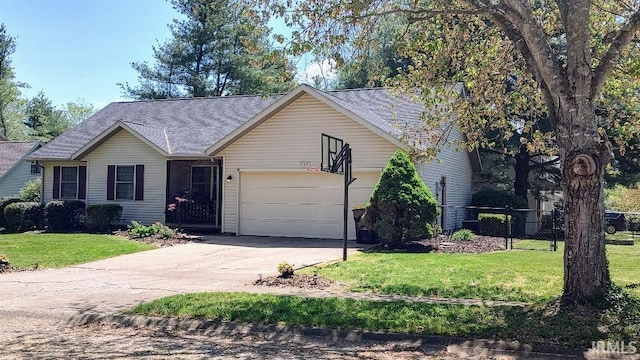 337 W White Pine Ct, Bloomington, IN 47403 - ranch-style home with an attached garage, fence, aphalt driveway, a shingled roof, and a front yard