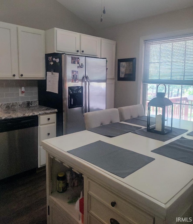 337 W White Pine Ct, Bloomington, IN 47403 - kitchen featuring stainless steel appliances, white cabinetry, decorative backsplash, vaulted ceiling, and light countertops