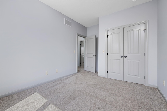 10155 Douglass Rd, Fort Wayne, IN 46835 - unfurnished bedroom featuring carpet flooring, a closet, visible vents, and baseboards