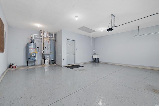 10155 Douglass Rd, Fort Wayne, IN 46835 - garage with water heater, heating unit, baseboards, and a garage door opener