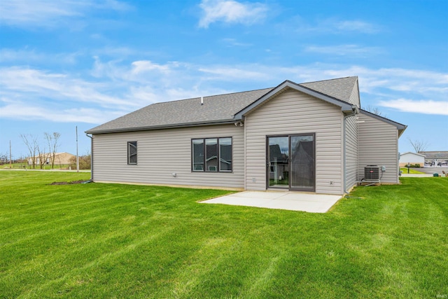 10155 Douglass Rd, Fort Wayne, IN 46835 - back of property with a patio, a shingled roof, central AC, and a lawn