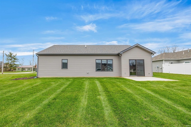 10155 Douglass Rd, Fort Wayne, IN 46835 - rear view of house with a lawn, a patio, roof with shingles, and fence