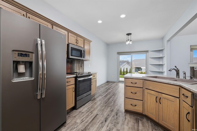 10155 Douglass Rd, Fort Wayne, IN 46835 - kitchen with light wood finished floors, a sink, stainless steel appliances, light countertops, and recessed lighting