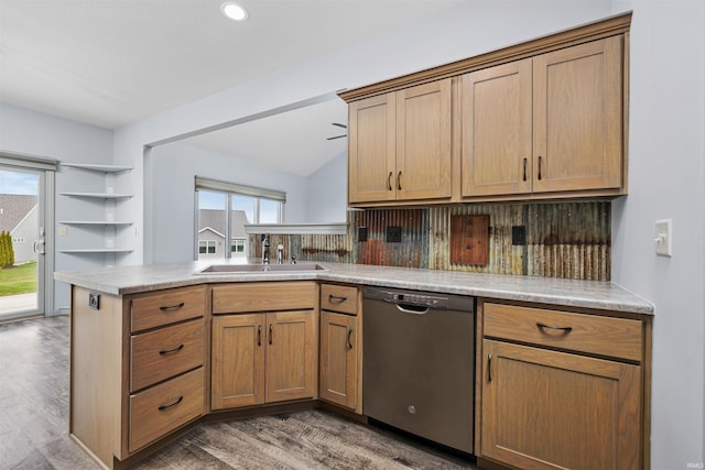 10155 Douglass Rd, Fort Wayne, IN 46835 - kitchen featuring a peninsula, a sink, dishwasher, light wood-style floors, and tasteful backsplash
