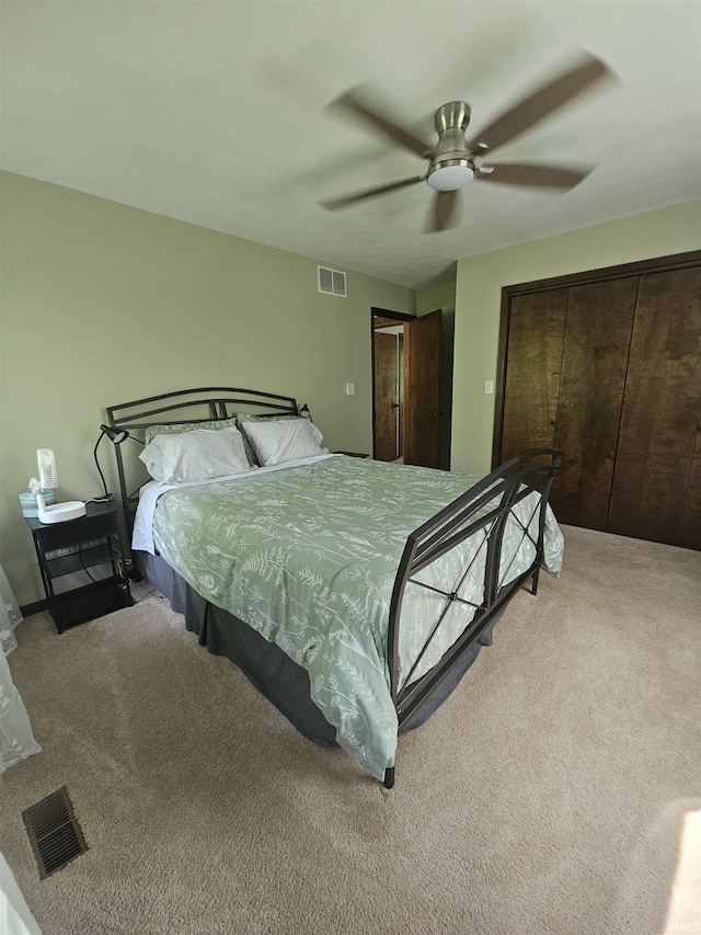bedroom with ceiling fan, carpet flooring, and visible vents