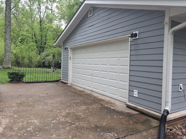 garage with aphalt driveway
