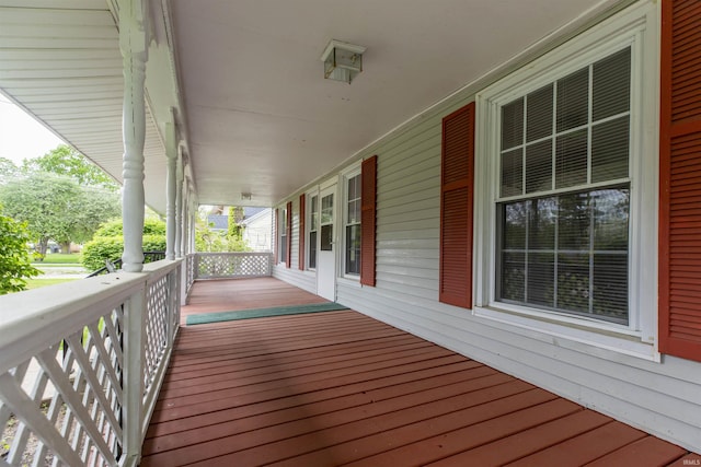 wooden terrace with a porch