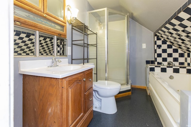 bathroom featuring toilet, vanity, vaulted ceiling, a shower stall, and a garden tub