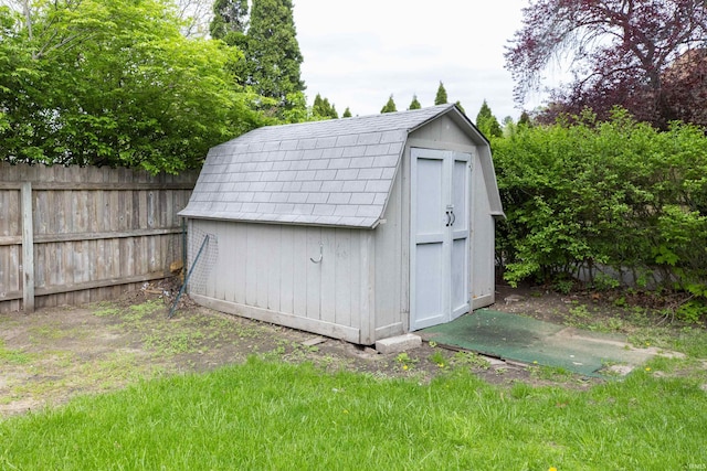 view of shed with fence