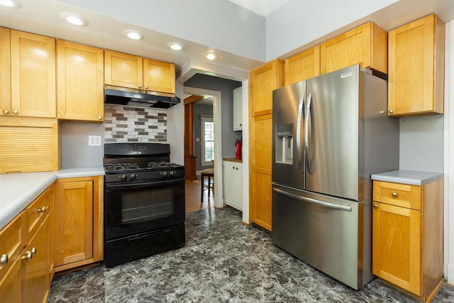 kitchen featuring under cabinet range hood, black gas range, light countertops, backsplash, and stainless steel fridge with ice dispenser