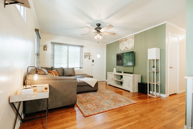 1732 Marbo Ave, Evansville, IN 47714 - living area with ceiling fan, crown molding, wood finished floors, and baseboards
