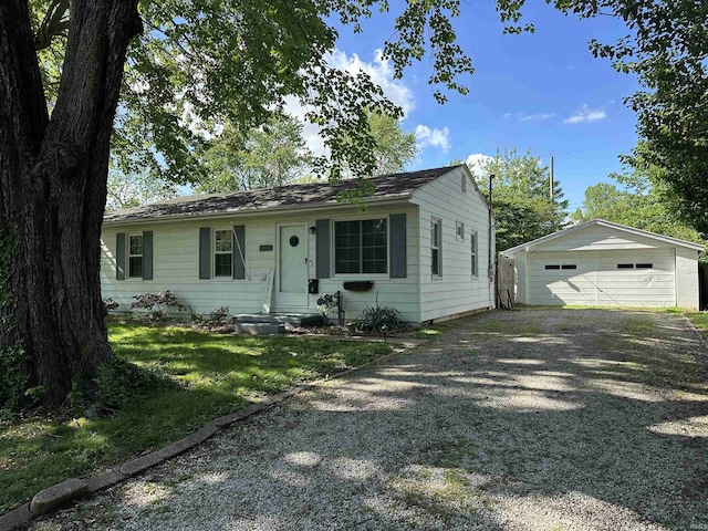 view of front facade with an outdoor structure and a garage