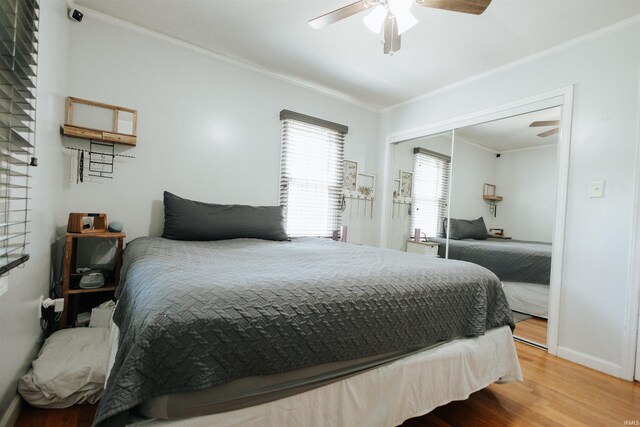 1732 Marbo Ave, Evansville, IN 47714 - bedroom with wood finished floors, crown molding, baseboards, a closet, and ceiling fan