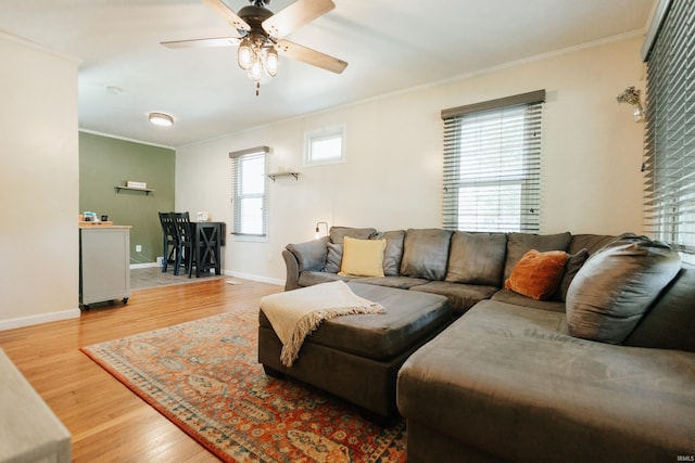 1732 Marbo Ave, Evansville, IN 47714 - living room featuring crown molding, ceiling fan, wood finished floors, and baseboards