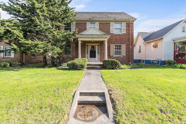 405 W Rudisill Blvd, Fort Wayne, IN 46807 - view of front facade featuring brick siding and a front yard