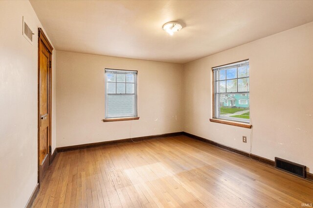 405 W Rudisill Blvd, Fort Wayne, IN 46807 - unfurnished room with a healthy amount of sunlight, wood-type flooring, and visible vents