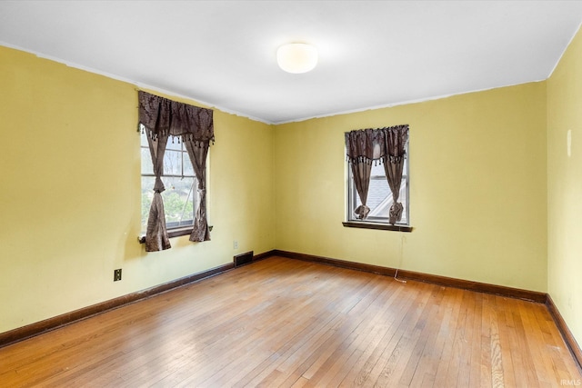 405 W Rudisill Blvd, Fort Wayne, IN 46807 - unfurnished room featuring baseboards, crown molding, visible vents, and hardwood / wood-style flooring