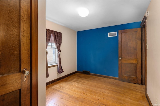 405 W Rudisill Blvd, Fort Wayne, IN 46807 - unfurnished bedroom with baseboards, light wood-type flooring, and visible vents