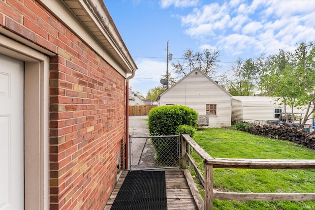 405 W Rudisill Blvd, Fort Wayne, IN 46807 - view of property exterior featuring brick siding, fence, and a lawn