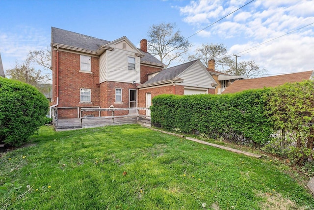 405 W Rudisill Blvd, Fort Wayne, IN 46807 - back of house featuring a yard, fence, a garage, and brick siding
