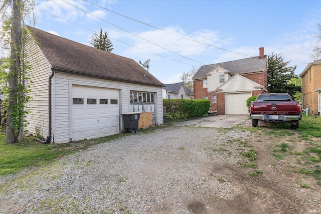 405 W Rudisill Blvd, Fort Wayne, IN 46807 - exterior space with an outdoor structure, roof with shingles, and a garage