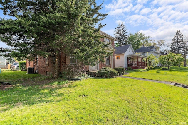 405 W Rudisill Blvd, Fort Wayne, IN 46807 - exterior space featuring cooling unit, brick siding, and a yard