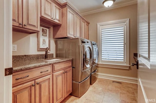 5318 Claiborn Ct, Newburgh, IN 47630 - clothes washing area with a sink, visible vents, washer and dryer, crown molding, and baseboards