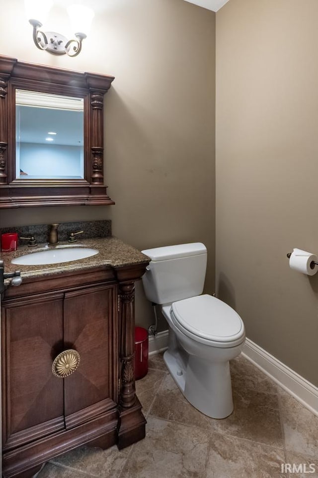 5318 Claiborn Ct, Newburgh, IN 47630 - bathroom with toilet, baseboards, and vanity
