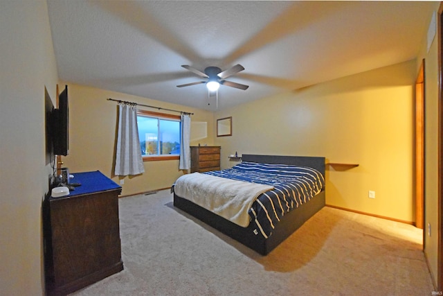 bedroom with baseboards, a ceiling fan, and carpet