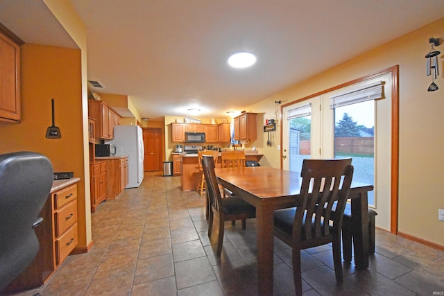 dining room featuring visible vents